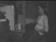Without being aware of a concealed camera, a lonely woman masturbates at home.
